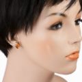 Darcie genuine Baltic honey amber stud drop earring in 925 sterling silver shown worn on model, handmade Polish amber jewelry on white background.