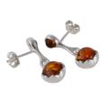 Back view of sterling silver Baltic honey amber soccer ball drop earrings with post back closure, showing genuine honey amber stones and polished 925 silver setting.