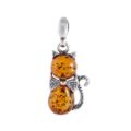 Sterling silver Baltic honey amber cat pendant necklace with bow detail, genuine Baltic amber lucky kitty charm on white background