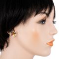 Side profile model wearing Clemence multicolor Baltic amber bow stud earrings in 925 sterling silver featuring honey, lemon, and green amber cabochons, post back closure, shown on ear against white background