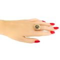 Image of Gold Plated Sterling Silver and Baltic Green Amber Sunflower Ring on model's hand