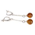 Sterling silver Baltic honey amber drop earrings with English lock closure shown flat, featuring round genuine amber cabochons on delicate chain, handmade Polish jewelry