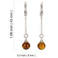 Sterling silver Baltic honey amber drop earrings with English lock closure shown with size guide, 1.68 inch total length and 0.3 inch round genuine amber cabochons
