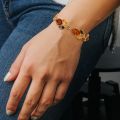 gold bracelet with amber stone on model