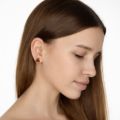 Model wearing square genuine Baltic honey amber stud earrings set in 925 sterling silver, showing natural size and elegant everyday fit