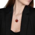 Model wearing genuine Baltic amber rose pendant in 925 sterling silver floral setting on delicate silver chain