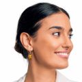 Baltic honey amber oval drop earrings worn on ear, set in 925 sterling silver with French leverback closure, showing elegant 1.4" drop length and natural amber inclusions