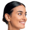 Model wearing genuine Baltic honey amber drop earrings in 925 sterling silver, lightweight round amber stones on leverback hooks, elegant minimalist amber jewelry shown on woman for everyday wear