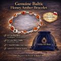 Genuine Baltic honey amber bracelet product infographic showing a sterling silver and honey amber link bracelet, “Made in Gdańsk, Poland” badge, feature list (925 sterling silver, hypoallergenic, tarnish resistant, genuine Baltic amber, 7-inch bracelet with lobster claw clasp, authenticity certificate included), and a blue Holiday Gift Shops gift pouch on a dark gold textured background.