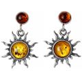 Pair of genuine Baltic honey amber “Sun” earrings in 925 sterling silver, two-tone amber stud dangle design with sunburst setting and post back closures on white background.