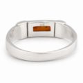 Inside view of a sterling silver ring showing the 925 stamp and a small amber inset.