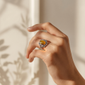 Sterling silver Baltic honey amber ring worn on hand, featuring a natural amber gemstone in a polished 925 silver setting, handcrafted women’s amber jewelry