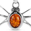 Close-up of the back of the pendant, showing the 925 sterling silver hallmark above the central amber stone.