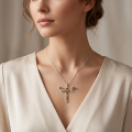 A model wearing the Baltic Amber Dragonfly Pendant in Sterling Silver, showing how the pendant hangs on a delicate chain at the neckline.