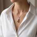 London Baltic Honey Amber Pendant in Sterling Silver worn on a delicate chain, showcasing warm Baltic amber stones in an elegant contemporary silver setting.