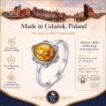 Brittany Baltic Amber Ring in Sterling Silver infographic highlighting authentic Baltic amber, 925 sterling silver, handcrafted craftsmanship, ring dimensions, and Made in Gdańsk, Poland heritage.