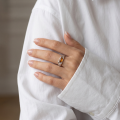 Woman wearing the Lucy Baltic Amber Ring in Sterling Silver, showcasing genuine Baltic amber and polished 925 sterling silver in an elegant luxury jewelry lifestyle setting.