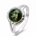Clara Baltic Green Amber Ring in Sterling Silver featuring a genuine green Baltic amber gemstone set in polished 925 sterling silver, isolated on a white background.
