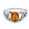 Celtic Knots Baltic Honey Amber Ring in Sterling Silver featuring a genuine honey Baltic amber gemstone set in polished 925 sterling silver with an intricate Celtic knot design, isolated on a white background.