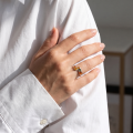 Woman wearing the Aria Multicolor Baltic Amber Ring in Sterling Silver, showcasing genuine multicolor Baltic amber and polished 925 sterling silver in an elegant luxury jewelry lifestyle setting.