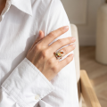 Woman wearing the Layla Multicolor Baltic Amber Ring in Sterling Silver, showcasing genuine multicolor Baltic amber and polished 925 sterling silver in an elegant luxury jewelry lifestyle setting.