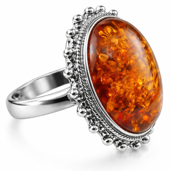Baltic Honey Amber Oval Classic Ring in Sterling Silver featuring a genuine oval honey Baltic amber gemstone set in polished 925 sterling silver, isolated on a white background.