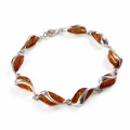 Baltic Honey Amber Bracelet in Sterling Silver featuring genuine honey Baltic amber gemstones set in polished 925 sterling silver, isolated on a white background.