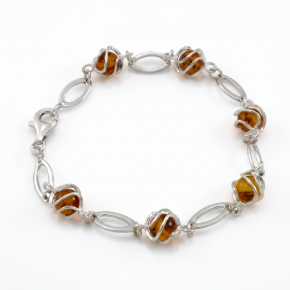 Baltic Honey Amber Bracelet in Sterling Silver featuring genuine honey Baltic amber gemstones set in polished 925 sterling silver, isolated on a white background.