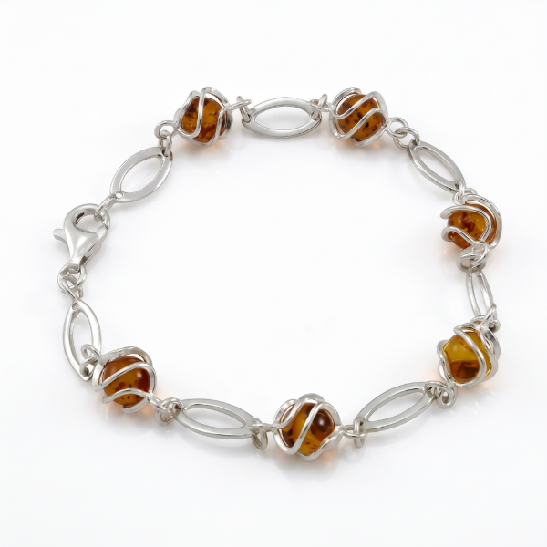 Baltic Honey Amber Bracelet in Sterling Silver featuring genuine honey Baltic amber gemstones set in polished 925 sterling silver, isolated on a white background.