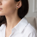 Woman wearing the Jasmine Multicolor Baltic Amber Earrings in Sterling Silver, showcasing genuine multicolor Baltic amber and polished 925 sterling silver in an elegant luxury jewelry lifestyle setting.