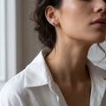 Woman wearing the Butterfly Multicolor Baltic Amber Earrings in Sterling Silver, showcasing genuine multicolor Baltic amber and polished 925 sterling silver in an elegant luxury jewelry lifestyle setting.