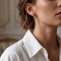 Woman wearing the Baltic Honey Amber Petal Round Stud Earrings in Sterling Silver, showcasing genuine honey Baltic amber and polished 925 sterling silver in an elegant luxury jewelry lifestyle setting.