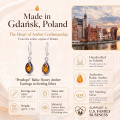 Penelope Baltic Honey Amber Earrings in Sterling Silver infographic highlighting authentic honey Baltic amber, 925 sterling silver, handcrafted craftsmanship, earring dimensions, and Made in Gdańsk, Poland heritage.