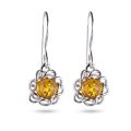 Baltic Honey Amber Drop Earrings in Sterling Silver featuring genuine honey Baltic amber gemstones set in polished 925 sterling silver, isolated on a white background.