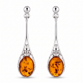 Maggie Baltic Honey Amber Earrings in Sterling Silver featuring genuine honey Baltic amber gemstones set in polished 925 sterling silver, isolated on a white background.