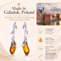 Daria Baltic Honey Amber Earrings in Sterling Silver infographic highlighting authentic honey Baltic amber, 925 sterling silver, handcrafted craftsmanship, earring dimensions, and Made in Gdańsk, Poland heritage.