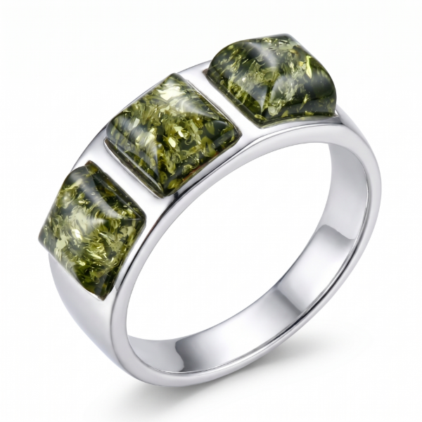 Mila Baltic Green Amber Ring in Sterling Silver featuring a genuine green Baltic amber gemstone set in polished 925 sterling silver, isolated on a white background.