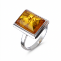 Baltic Honey Amber Rectangle Ring in Sterling Silver featuring a genuine rectangular honey Baltic amber gemstone set in polished 925 sterling silver, isolated on a white background.