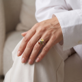 Woman wearing the Vikki Multicolor Baltic Amber Ring in Sterling Silver, showcasing genuine multicolor Baltic amber and polished 925 sterling silver in an elegant luxury jewelry lifestyle setting.