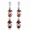 Gina Baltic Honey Amber Earrings in Sterling Silver featuring genuine honey Baltic amber gemstones set in polished 925 sterling silver, isolated on a white background.