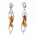 Baltic Honey Amber Earrings in Sterling Silver featuring genuine honey Baltic amber gemstones set in polished 925 sterling silver, isolated on a white background.