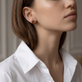 Woman wearing the Baltic Honey Amber Rectangular Stud Earrings in Sterling Silver, showcasing genuine rectangular honey Baltic amber and polished 925 sterling silver in an elegant luxury jewelry lifestyle setting.