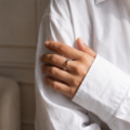 Woman wearing the Gothic Baltic Honey Amber Ring in Sterling Silver, showcasing genuine honey Baltic amber and polished 925 sterling silver in an elegant luxury jewelry lifestyle setting.