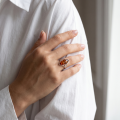 Woman wearing the Baltic Honey Amber Marquise Ring in Sterling Silver, showcasing genuine marquise-cut honey Baltic amber and polished 925 sterling silver in an elegant luxury jewelry lifestyle setting.