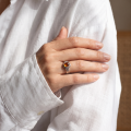 Woman wearing the Baltic Honey Amber Ring in Sterling Silver, showcasing genuine honey Baltic amber and polished 925 sterling silver in an elegant luxury jewelry lifestyle setting.