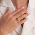 Brigitte Multicolor Baltic Amber Ring in Sterling Silver worn on a woman's finger, showcasing a flower-inspired design with genuine multicolor Baltic amber stones.