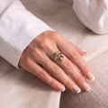 Woman wearing the Claudette Baltic Amber Ring in Sterling Silver, showcasing genuine Baltic amber and polished 925 sterling silver in an elegant luxury jewelry lifestyle setting.