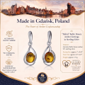 Helmi Baltic Honey Amber Earrings in Sterling Silver infographic highlighting authentic honey Baltic amber, 925 sterling silver, handcrafted craftsmanship, earring dimensions, and Made in Gdańsk, Poland heritage.