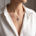 Woman wearing the Tree of Life Multicolor Baltic Amber Pendant in Sterling Silver, showcasing genuine multicolor Baltic amber and polished 925 sterling silver in an elegant luxury jewelry lifestyle setting.