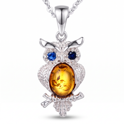 Owl Baltic Amber Pendant in Sterling Silver featuring genuine Baltic amber set in an owl-inspired polished 925 sterling silver design, isolated on a white background.